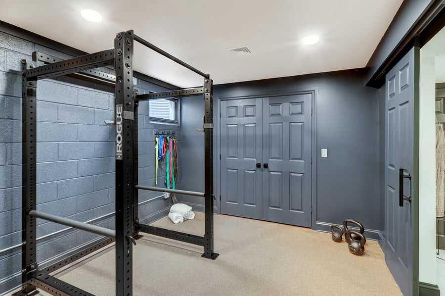 Home gym in color drenched room in lancaster basement remodel