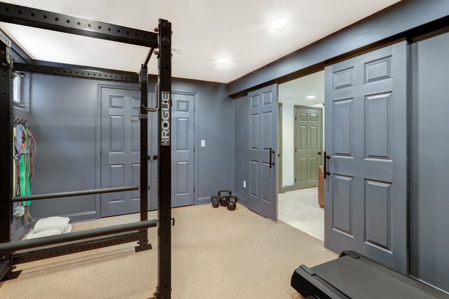 Lancaster Basement Remodel with home gym and sliding barn doors