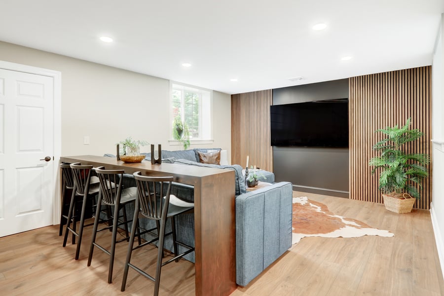 Entertainment are with custom wood paneling accent wall.