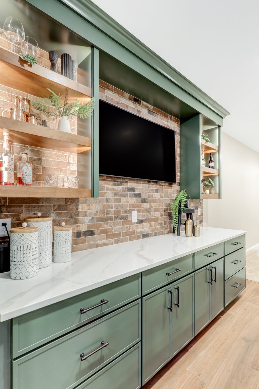 Open shelving, brick backsplash, and custom cabinetry in lancaster basement remodel