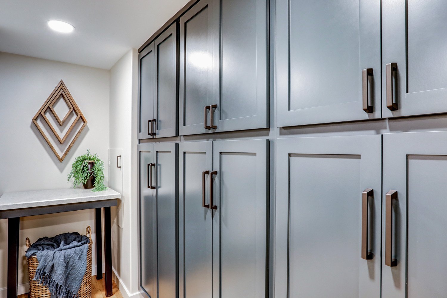 blue cabinets in Lancaster Basement Remodel with laundry room