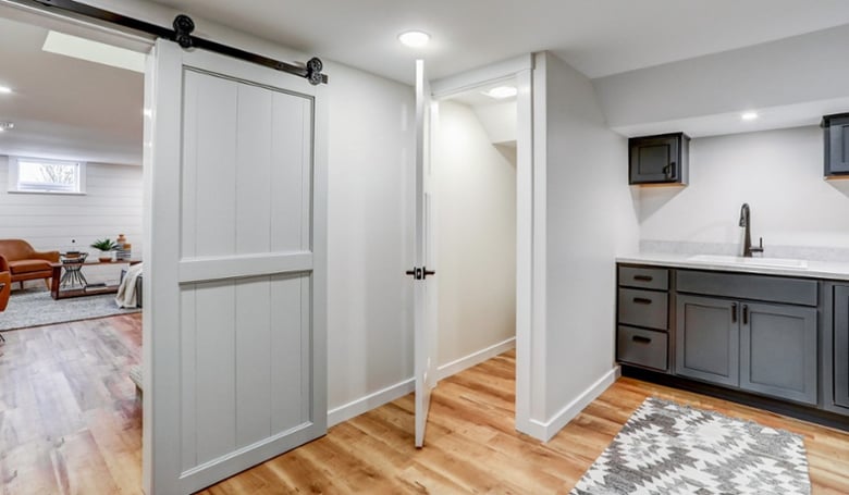 Laundry room and barn door in Manheim Township basement remodel