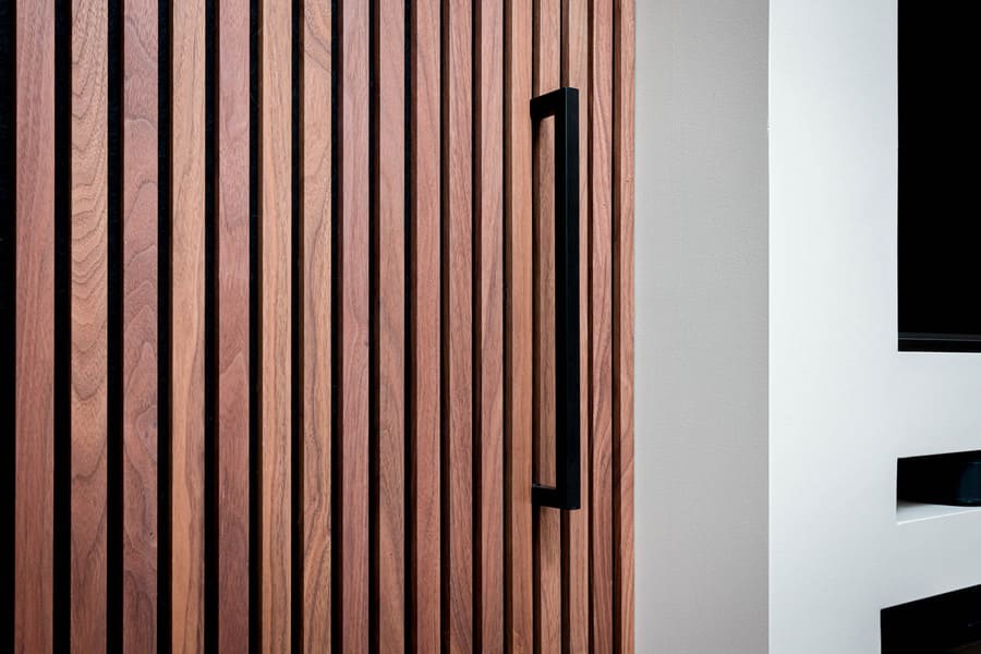 Lancaster Primary Bedroom Remodel with wood panel hidden door