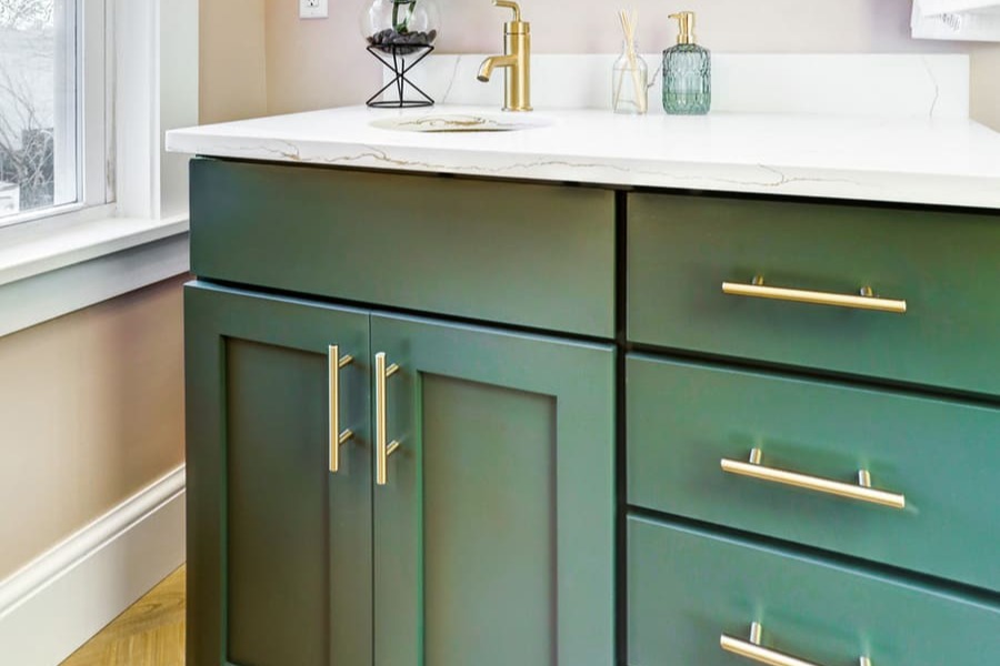 Green vanity with Gold hardware in Lancaster Primary Bathroom Remodel 