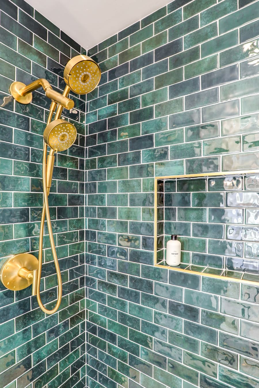 Lancaster Primary Bathroom Remodel with green shower tile and gold fixtures