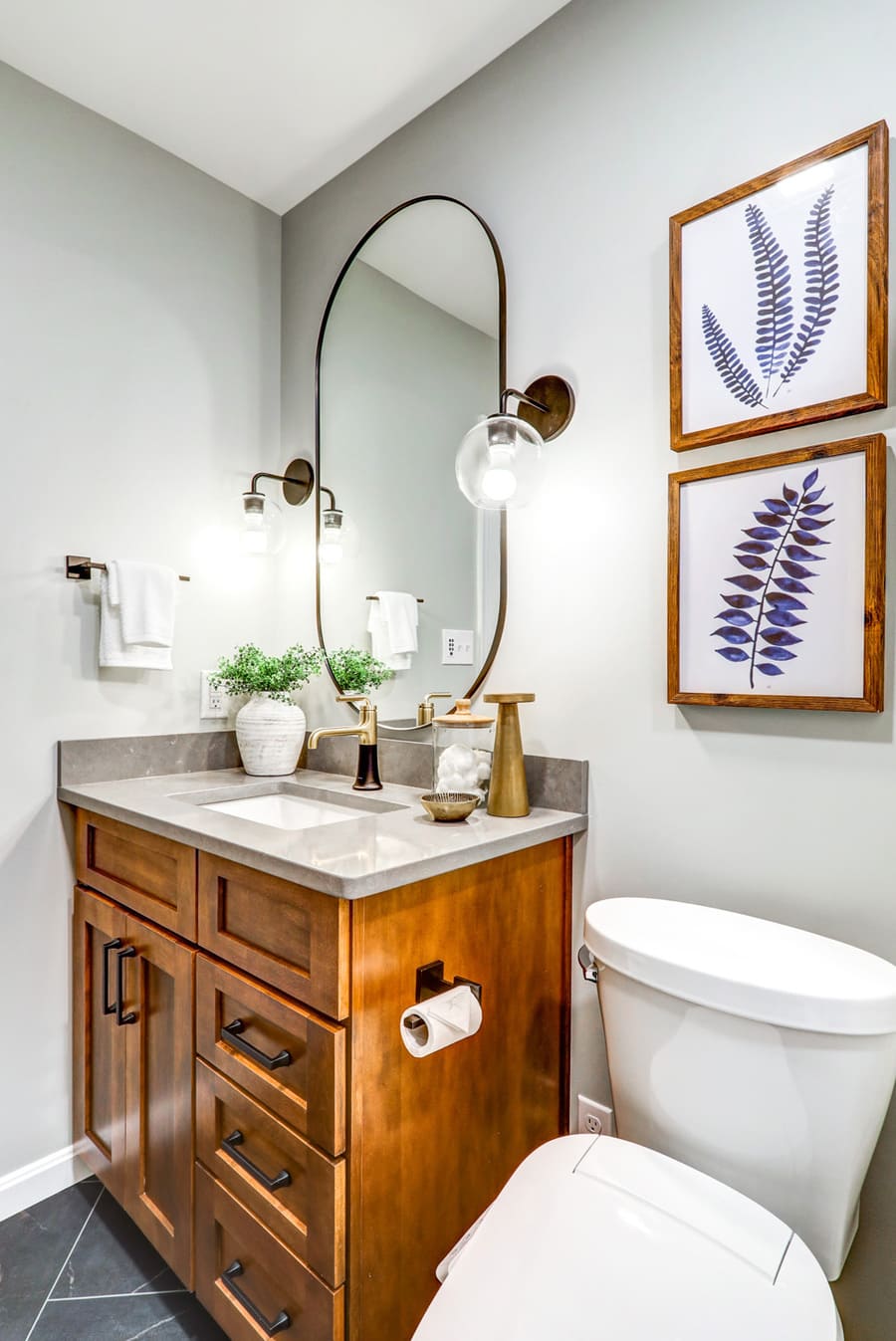 Lancaster Bathroom Remodel with dark wood vanity and matte black accessories