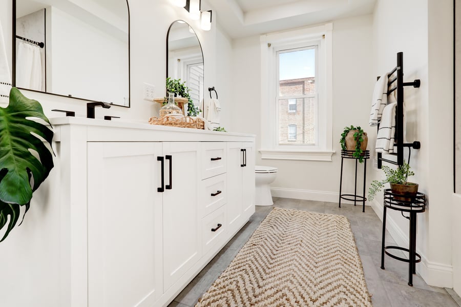 Lancaster Primary Bathroom Remodel with white double vanity