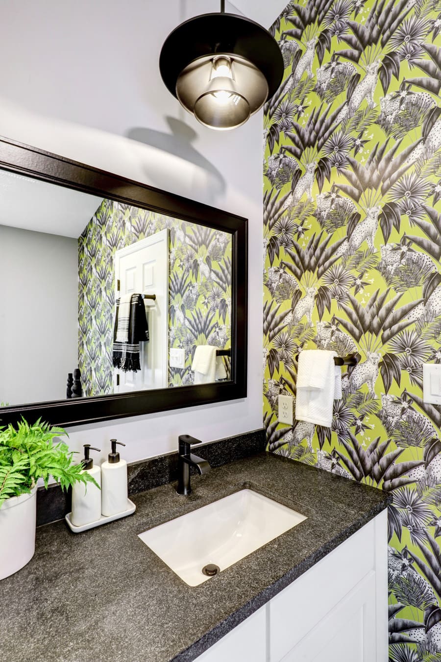 Lancaster Bathroom remodel with black granite countertop and wallpaper