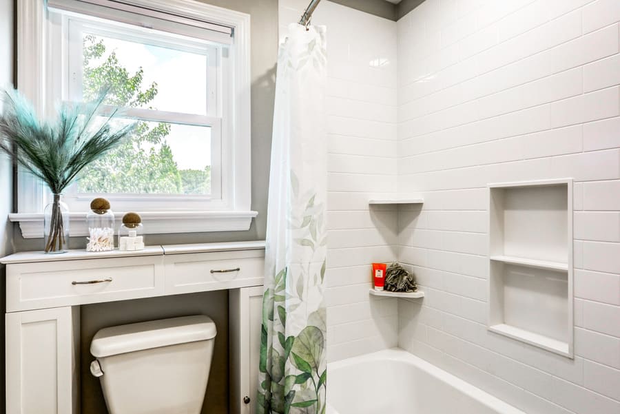 Lititz kids Bathroom remodel with tile shower surround and niches