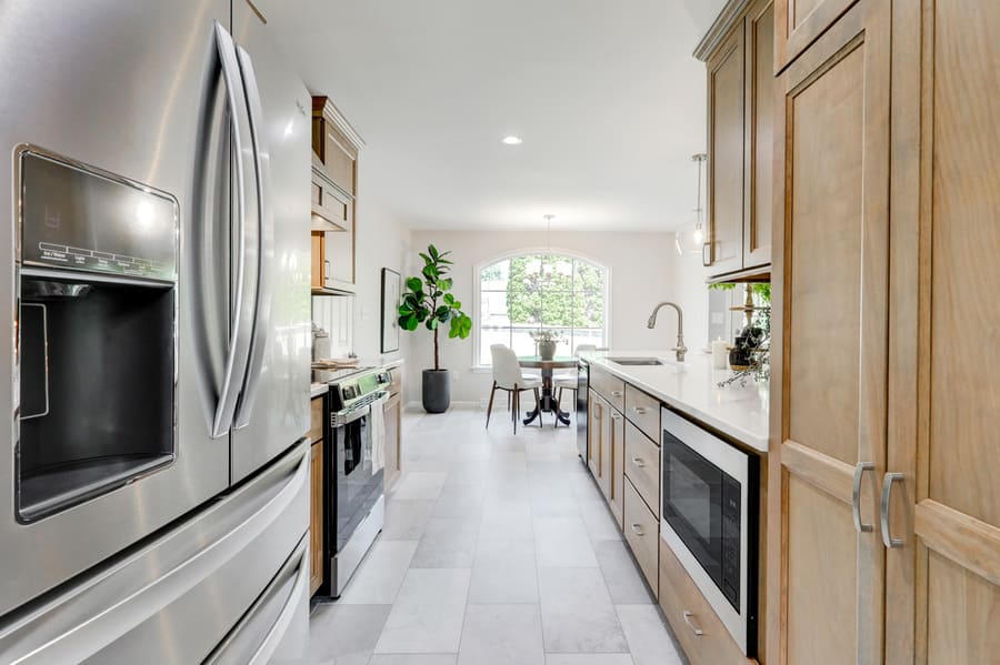 light brown cabinets and stainless steel appliances in Willow Street Kitchen Remodel