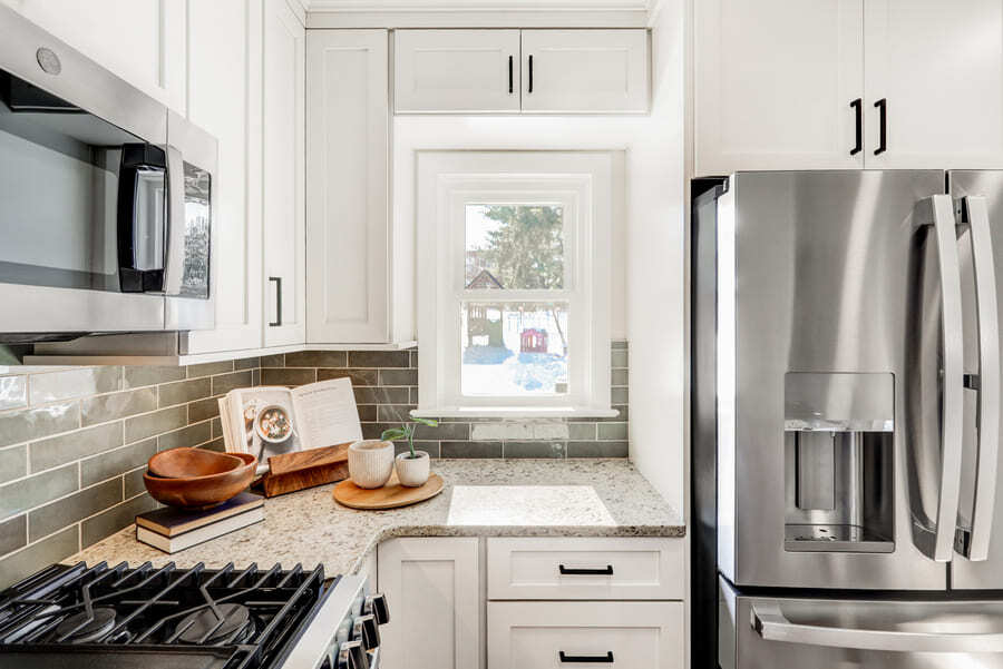 Lancaster Kitchen Remodel with white cabinets and green backsplash.
