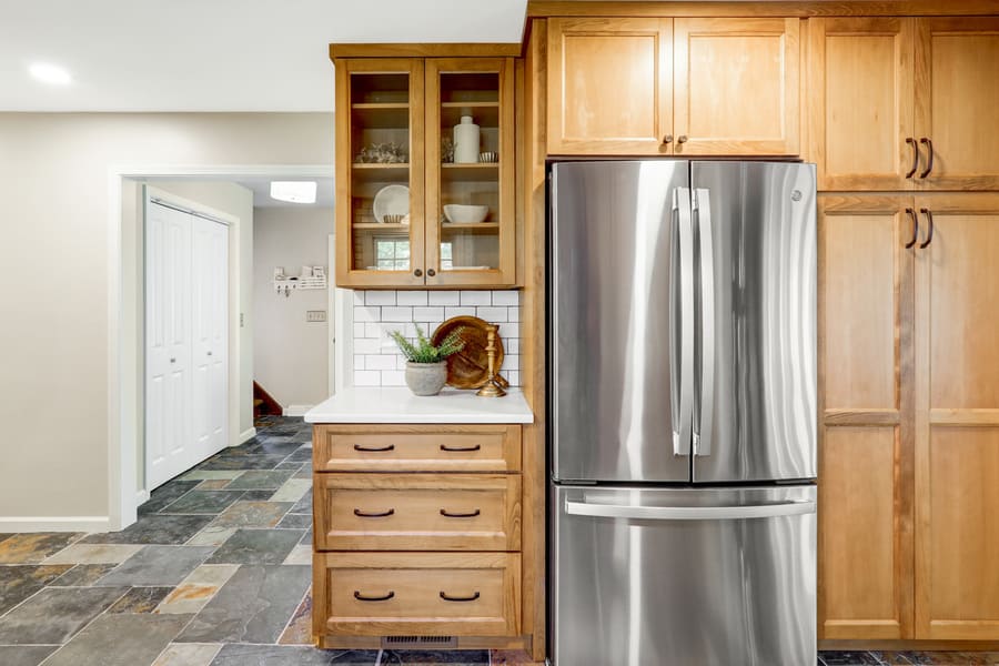 Elizabethtown kitchen remodel with brown cabinets and matte black hardware