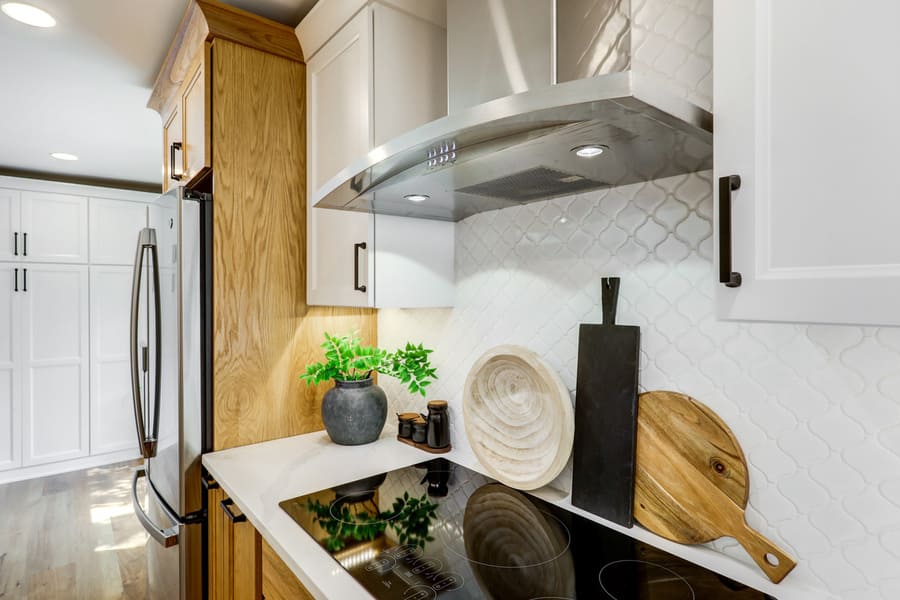 Landisville Kitchen remodel with a stainless steel range hood and induction stove top.