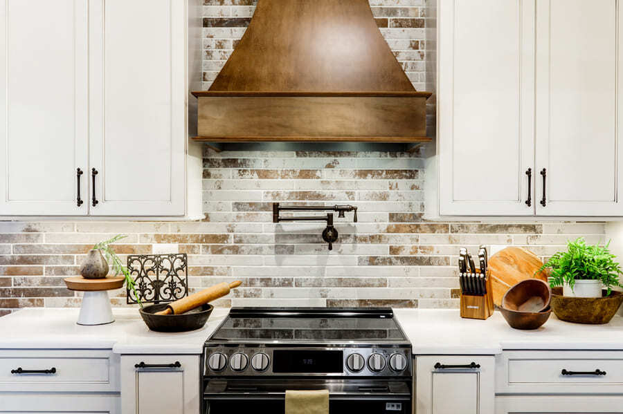 Lancaster Kitchen Remodel with rustic backsplash and custom range hood