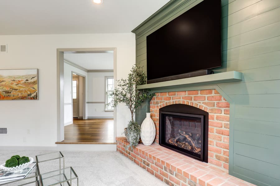 green shiplap fireplace surround in Strasburg kitchen remodel