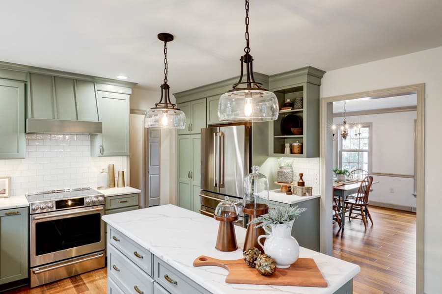 Kitchen island with matte black pendant lighting in Strasburg Kitchen remodel