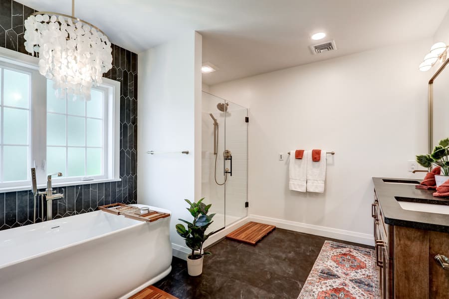 Lancaster primary bathroom addition with black flooring