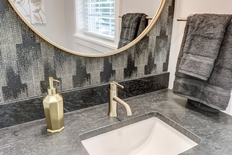 wallpaper and gold finishes in Lancaster powder room Remodel
