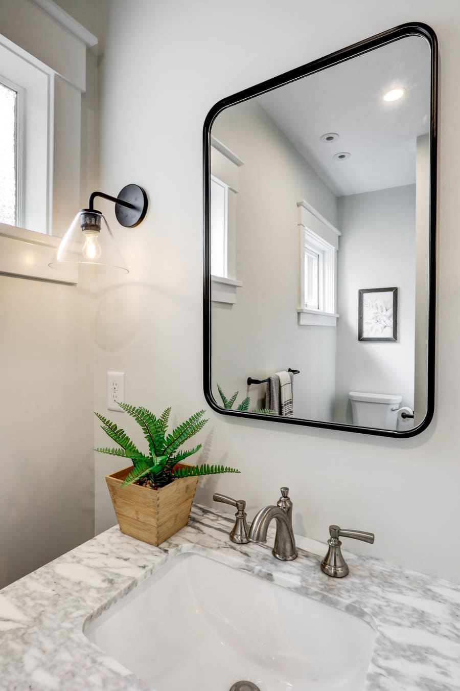 matte black mirror and marble countertop in Lancaster Bathroom remodel