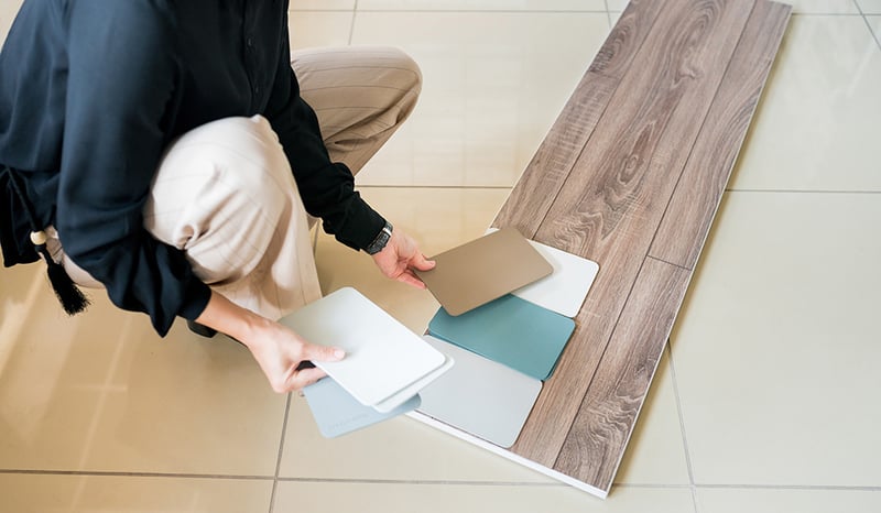 Woman selecting paint color