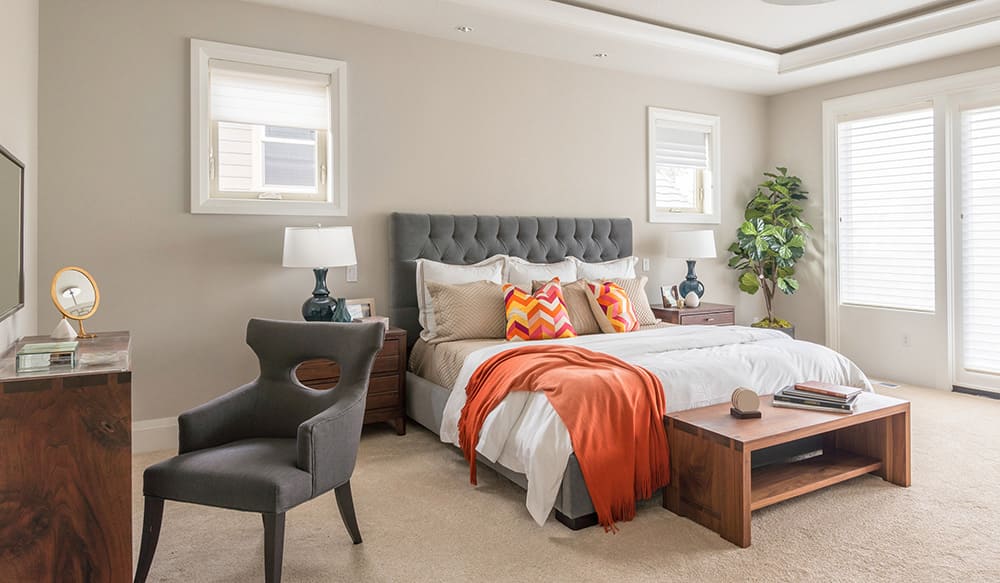 Bedroom with colorful pillows and blankets