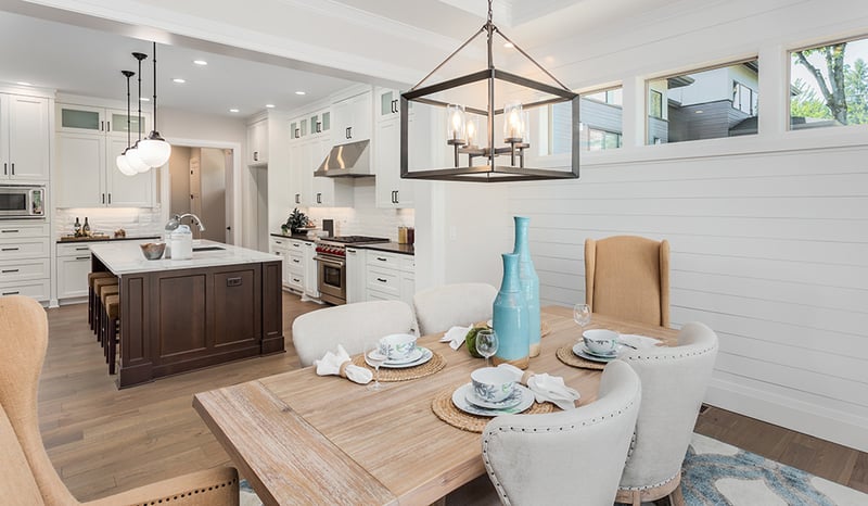 Dining room table with beautiful kitchen in the background