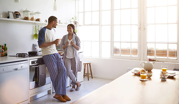 Man and woman talking in the kitchen