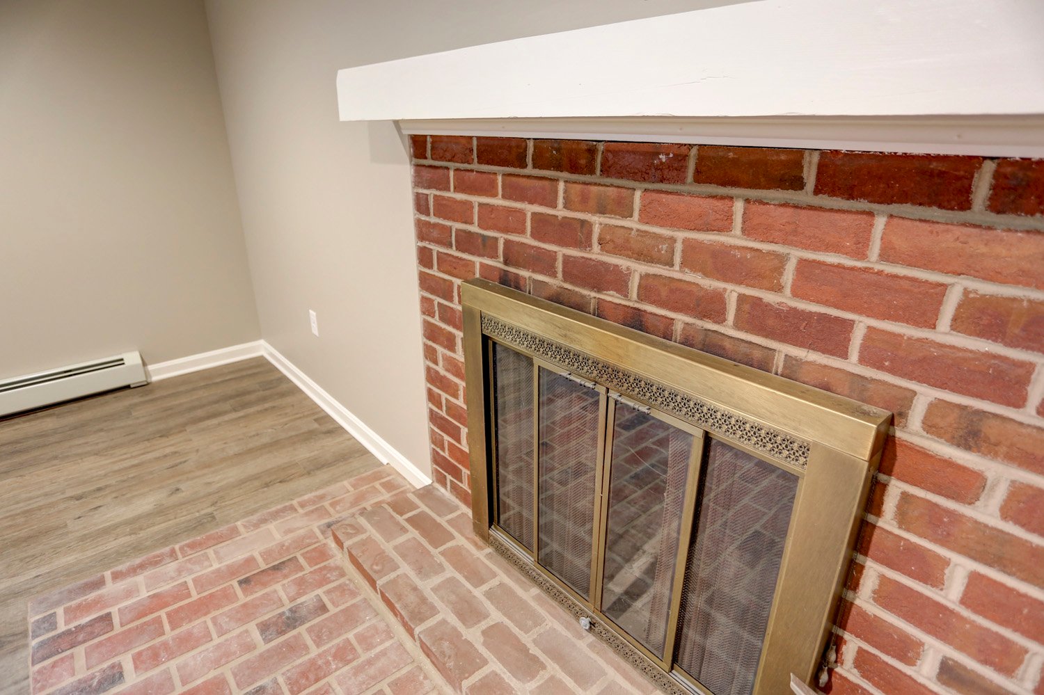 Brick Fireplace in Millersville Basement Remodel