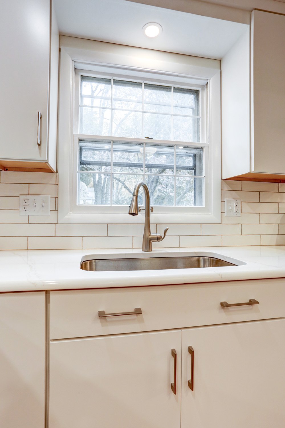 Single sink with stainless steel faucet in Bloomingdale Kitchen Remodel