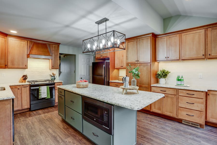 Wood cabinets and green island in Hempfield kitchen remodel