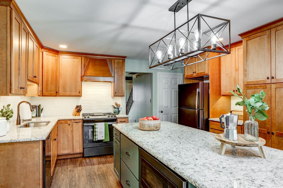 Hempfield Kitchen Remodel with brown cabinets and green island