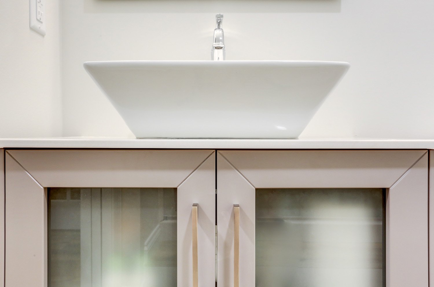 Basement bathroom with wood vanity and vessel sink in Lampeter