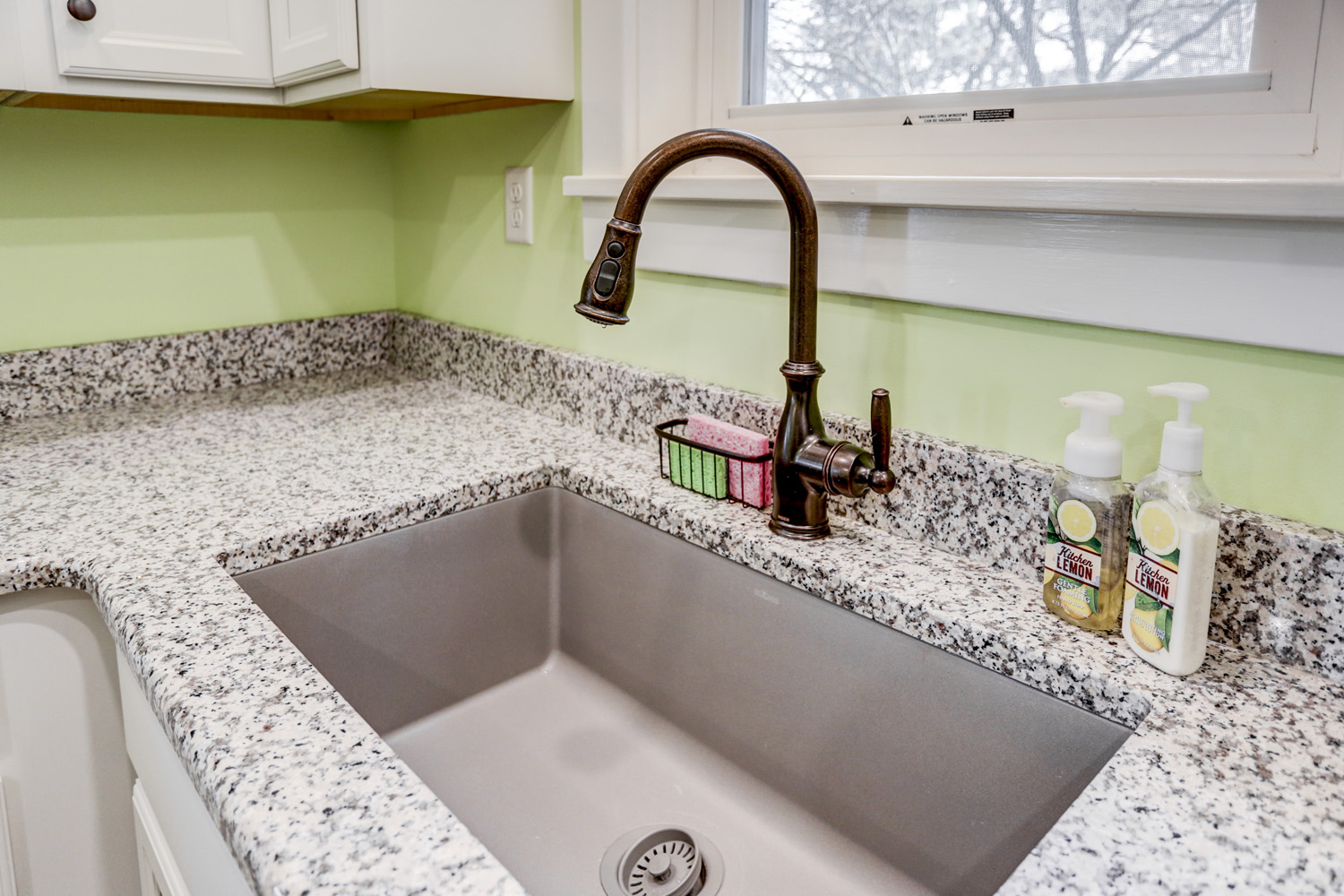 Single sink with oil rubbed bronze faucet in Lancaster City Kitchen Remodel