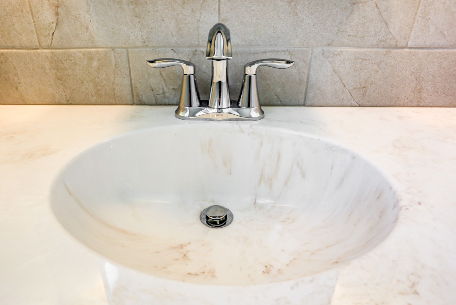 Swirl marble countertop with chrome faucet in Landisville Bathroom Remodel