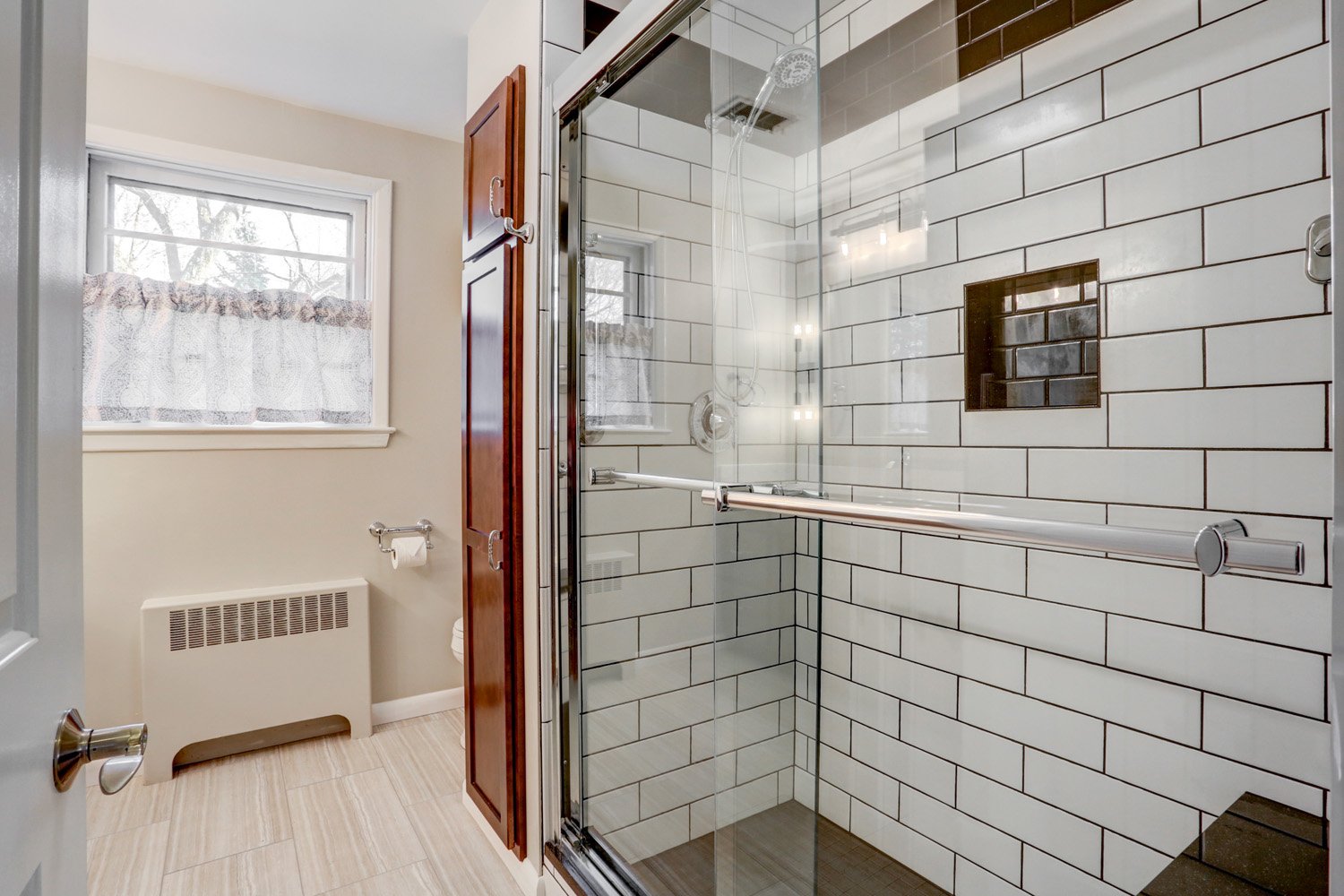 Manheim Township Bathroom Remodel with tile shower and sliding glass doors