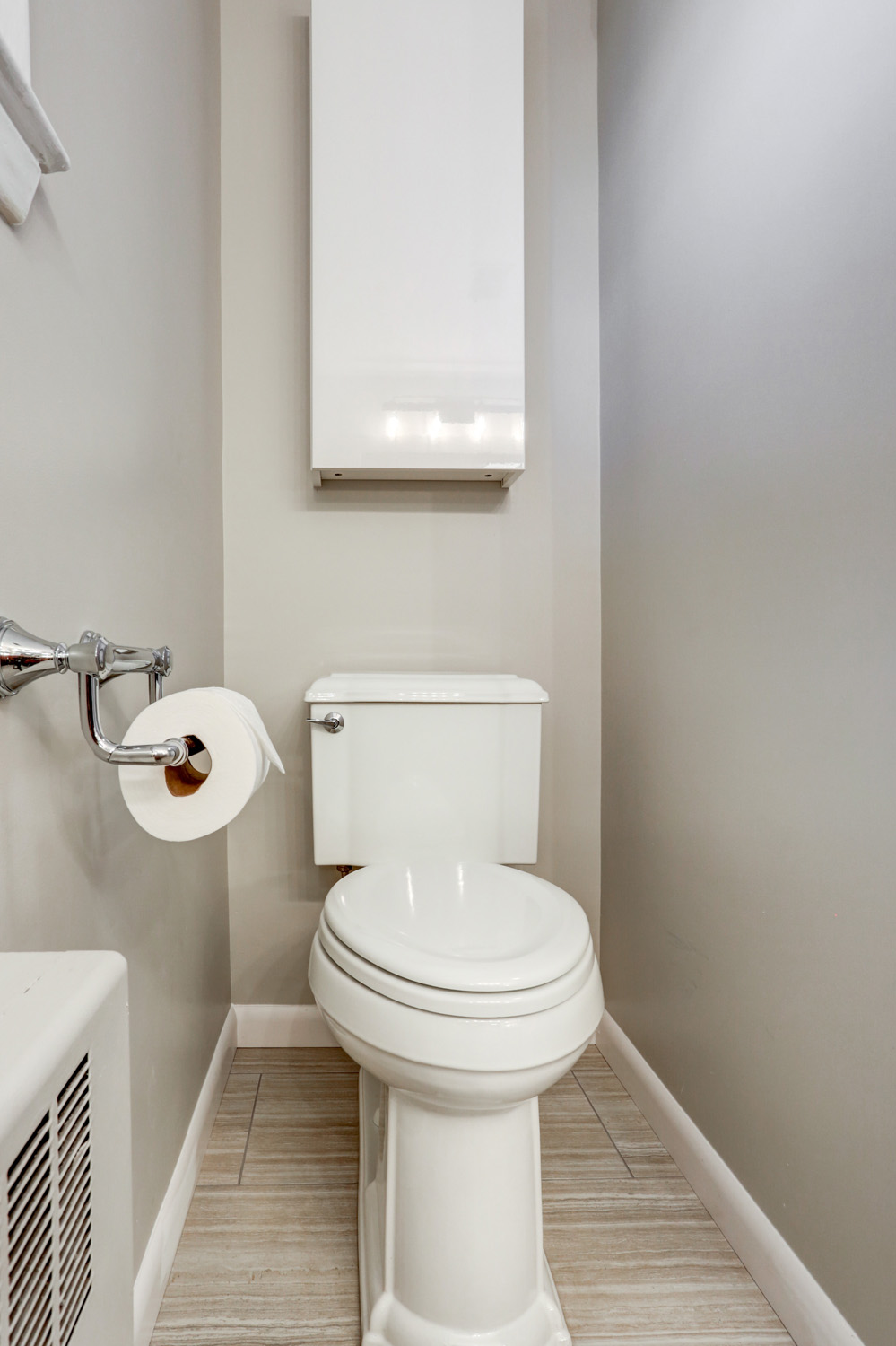 Toilet and storage cabinet in Manheim Township Bathroom Remodel