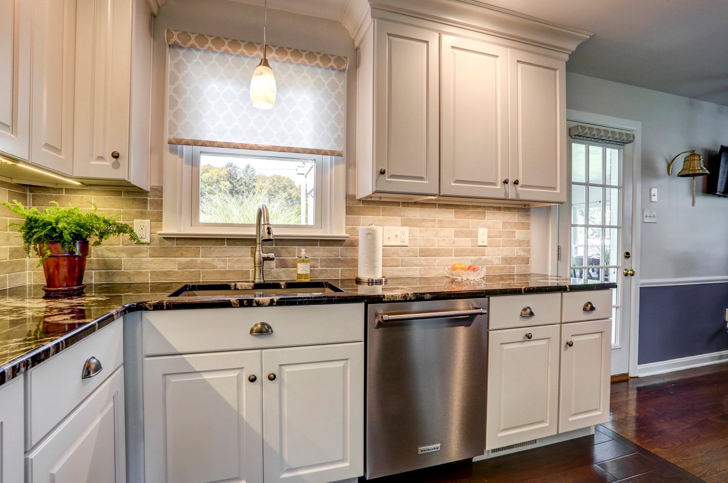 White Cabinets and Beige Tile Backsplash in Manheim Township Kitchen Remodel