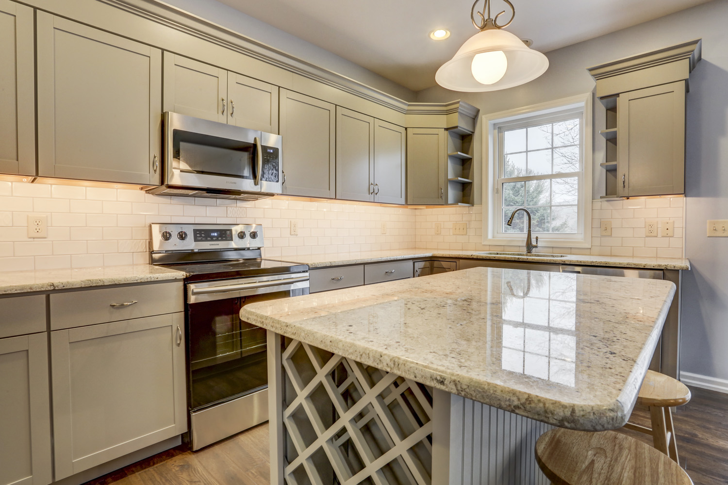 Island with wine stand and seating in Marietta Kitchen Remodel