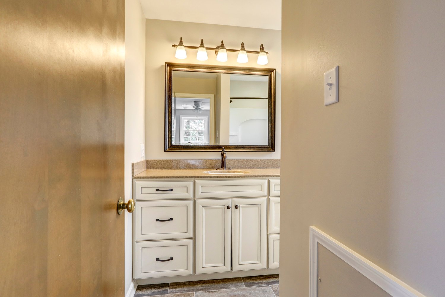 White Cabinets with oil rubbed finishes in Millersville Double Bathroom Remodel