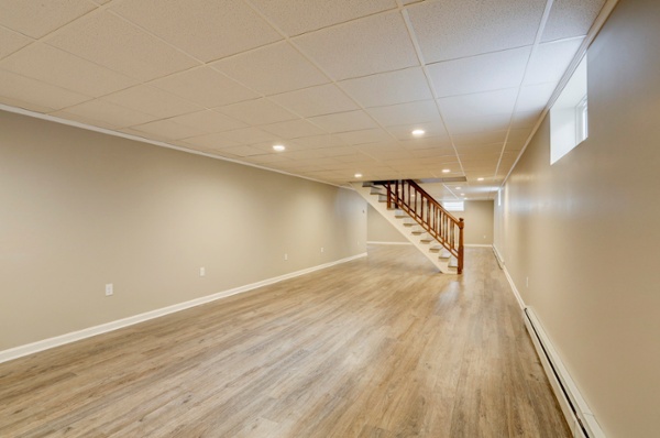 Large open basement with drop ceiling