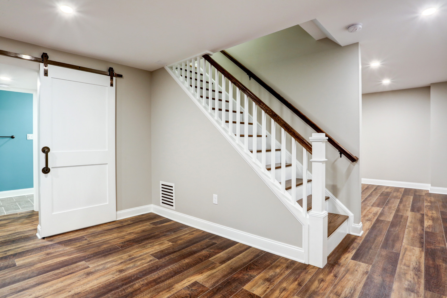 Staircase and wood floor in Lancaster finished basement