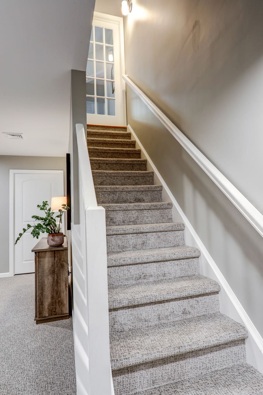 carpeted stairs in Manor Township Basement Remodel