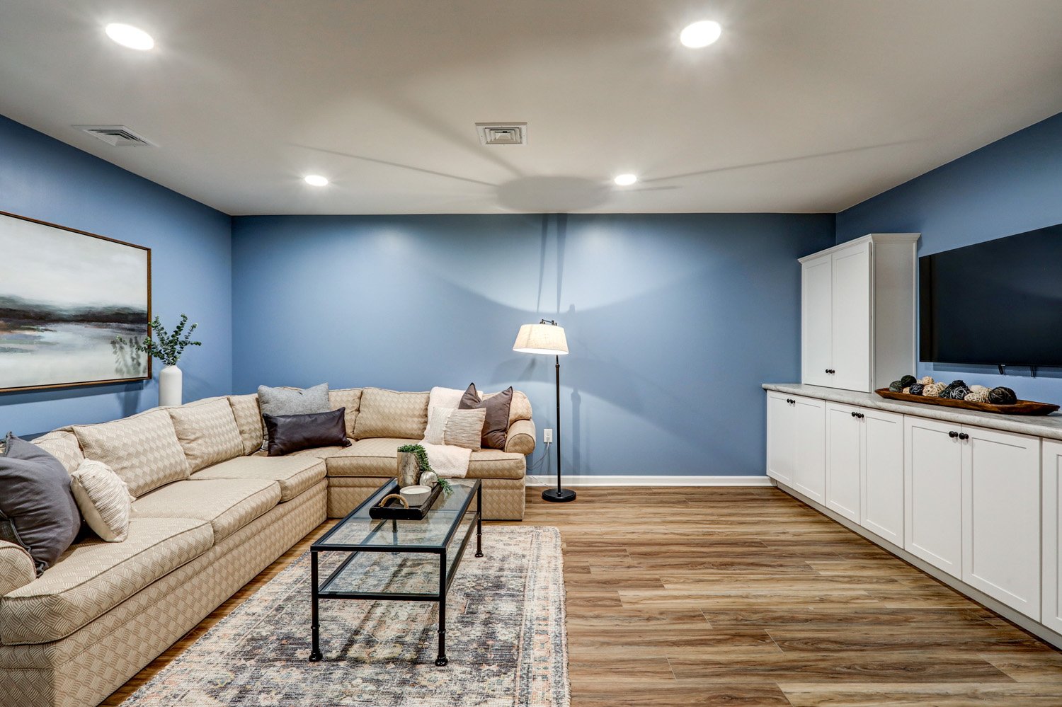 Manheim Basement Remodel with built in entertainment cabinets