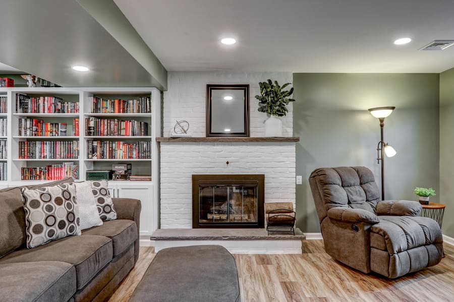 Lititz Basement Remodel with built in shelves and fireplace