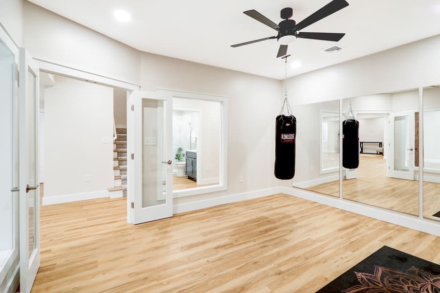 gym in Lititz Basement Remodel with mirrors and windows