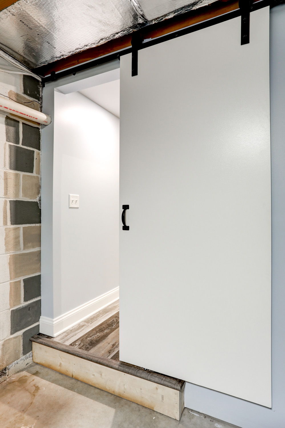 barn doors in storage room of Millersville Basement Remodel