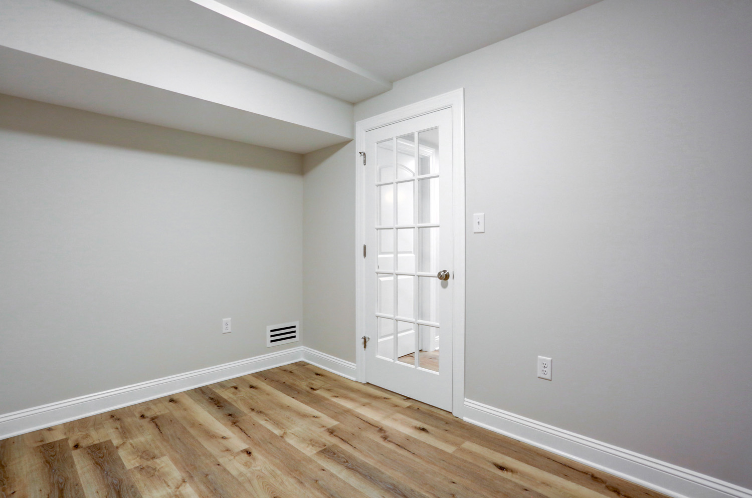 Lancaster basement remodel with bedroom with glass door