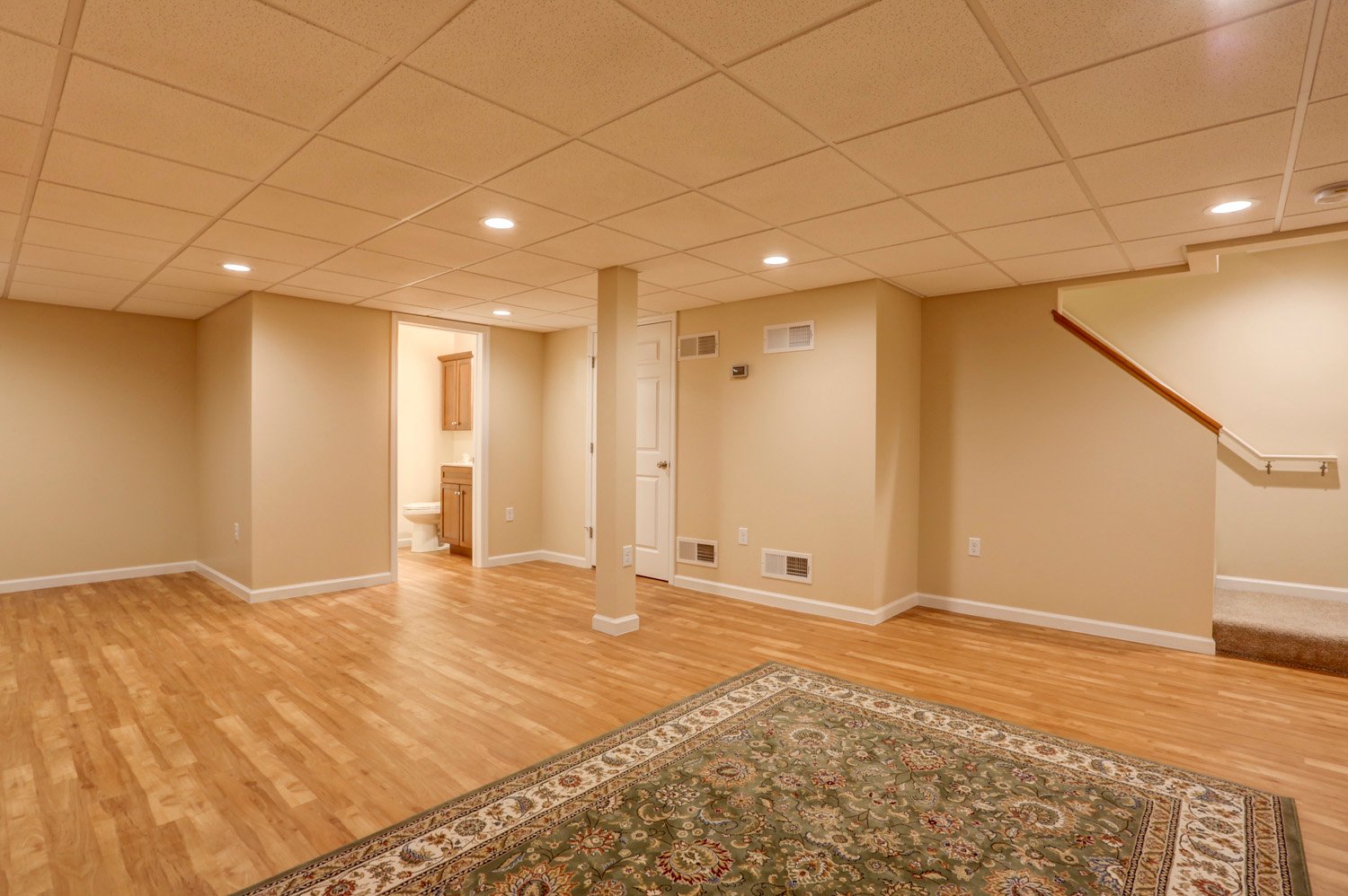 Wood flooring and drop ceiling in Lititz basement remodel