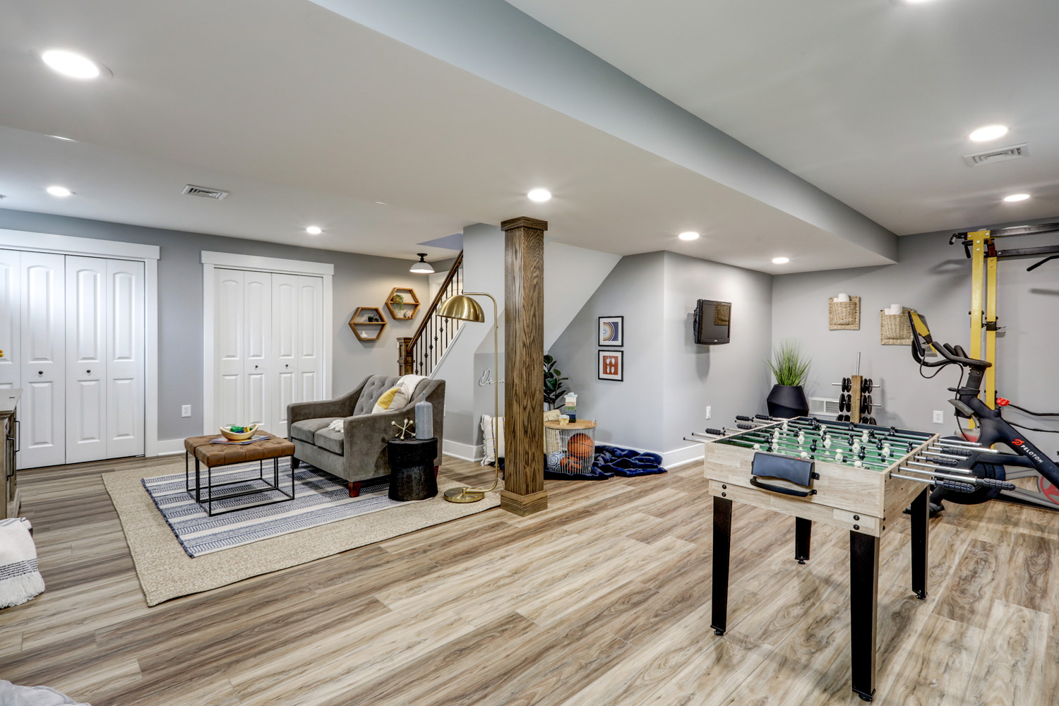 Gray walls and vinvyl plank flooring in Lititz Basement Remodel