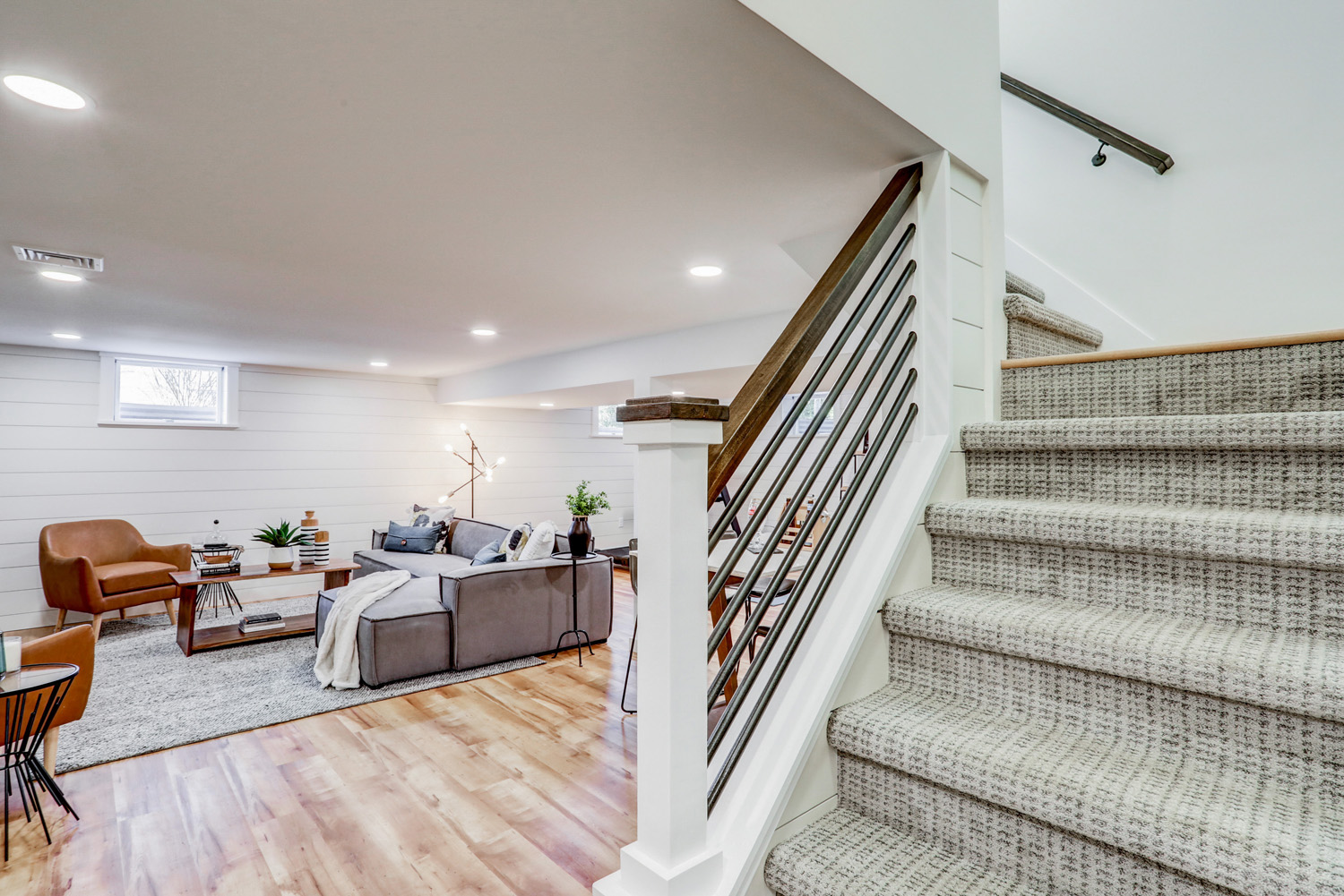 Carpet stairway and industrial railing in Lancaster Basement Remodel